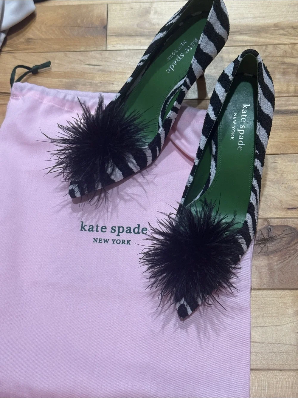 kate spade Black and White Zebra Pointed Toe Pumps with Black Feather Pom